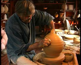 Peter at wheel making vase